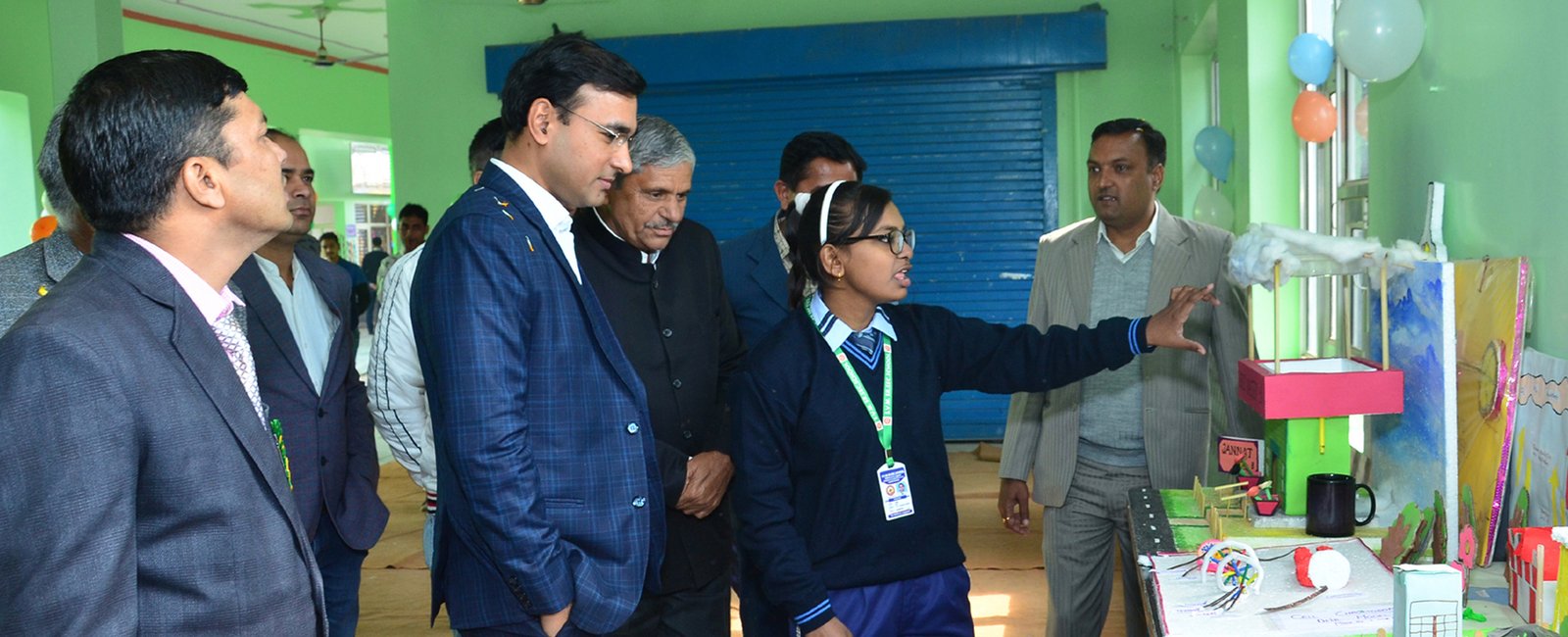 Panoramic view of Saraswati Vidya Mandir school campus showing modern buildings and green spaces