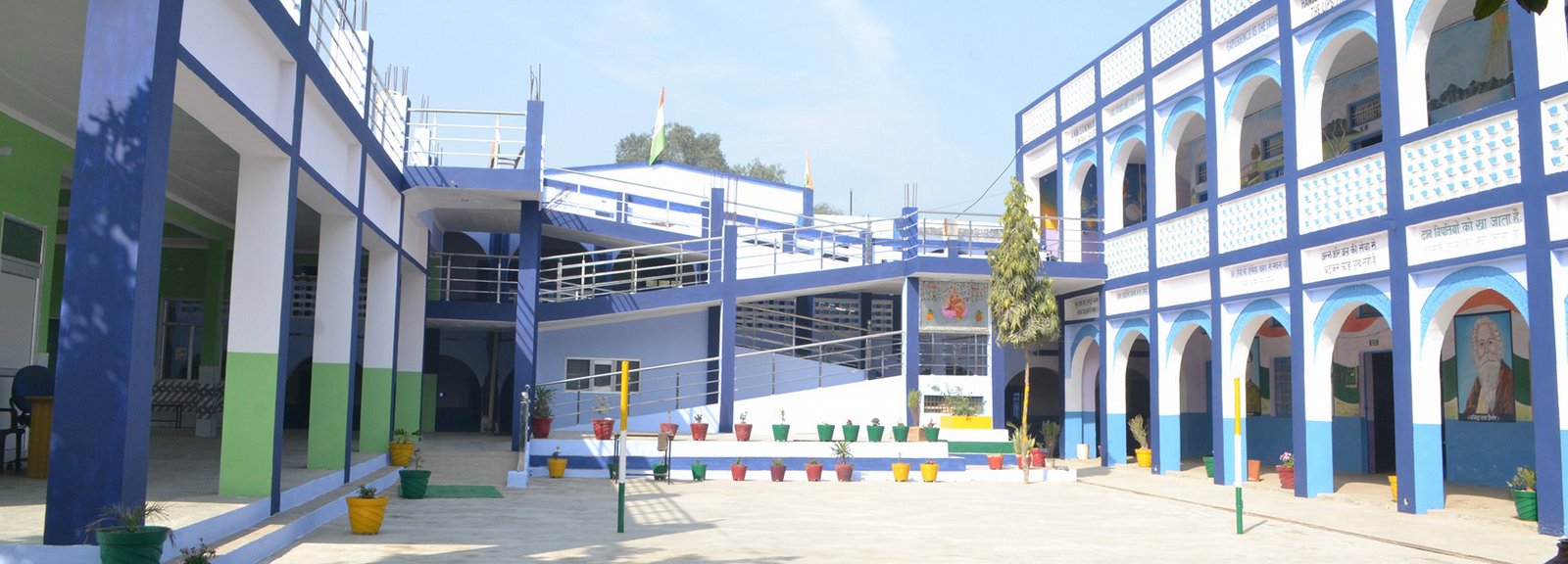 Panoramic view of Saraswati Vidya Mandir school campus showing modern buildings and green spaces